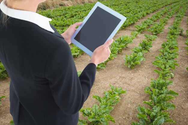 lady with tablet in field