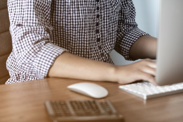 Lady working at home with computerncept,Soft focus.