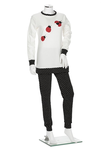 A ladybug shirt with polka dots and a white shirt with black polka dots.