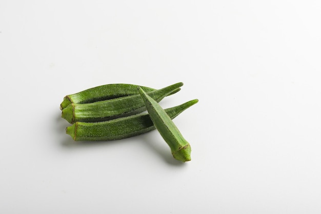 ladyfinger or okra on white background