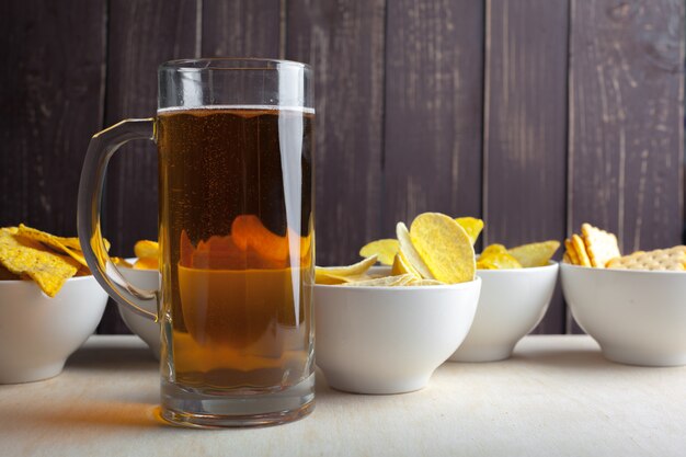 Lager beer in glass and potato chips