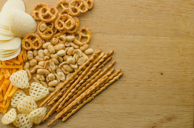 Lager beer and snacks on table. 