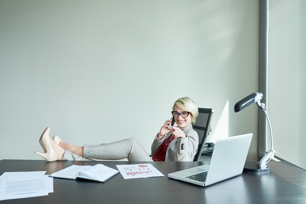 Laid-Back Businesswoman at Workplace