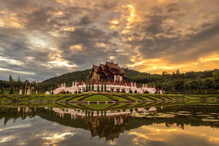 Photo lake against building during sunset