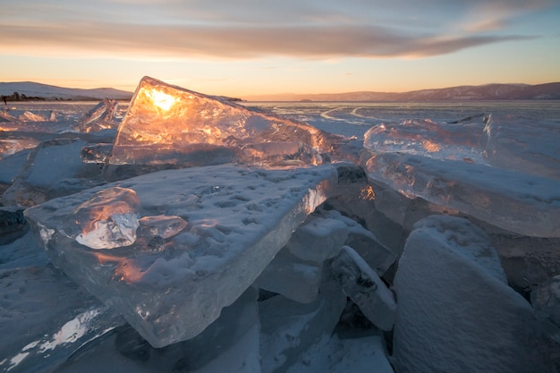 Lake Baikal at sunset, everything is covered with ice and snow