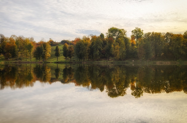 Lake and beautiful autumn landscape with reflection