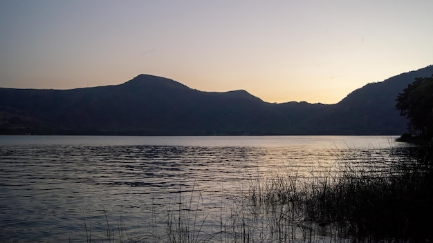 Lake of chapala jalisco mexico lake at sunset with fishing boats sun reflection on the lake mexico