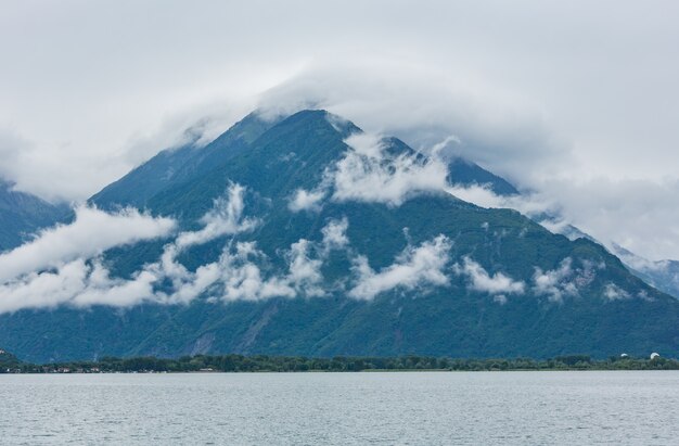 Lake Como (Italy) summer view with mount top in clouds.