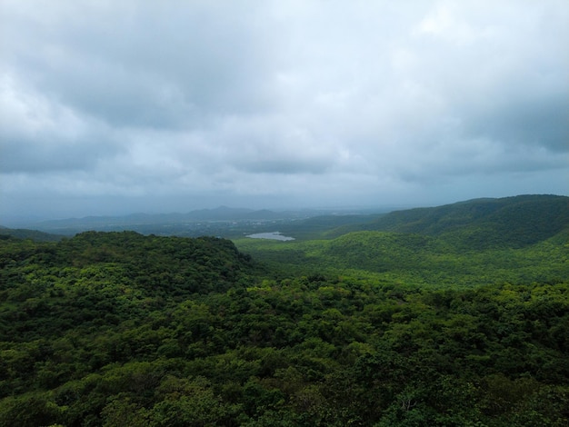 Lake and forest View from top at tandulwadi fort in monsoon season Scenic landscape in India