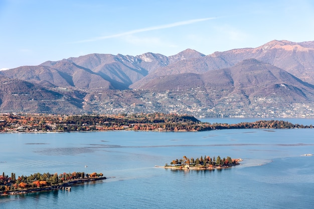 Lake Garda coastline and small Rabbit Island on a sunny autumn day