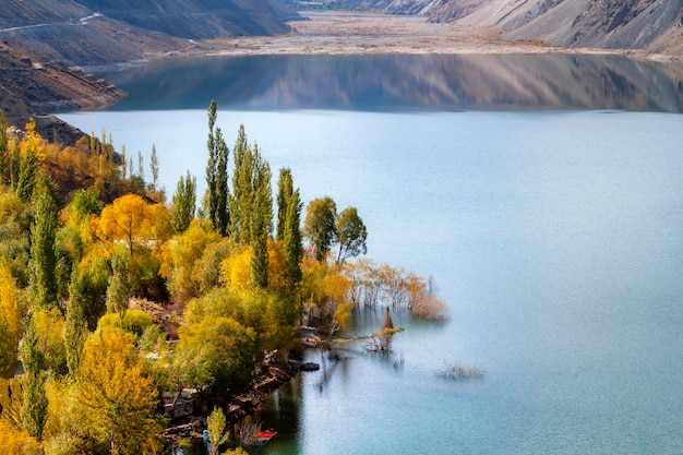 A lake in the mountains with a boat in the water