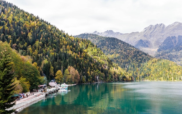 Lake Ritsa in Abkhazia in autumn, lake view with autumn forest in the background