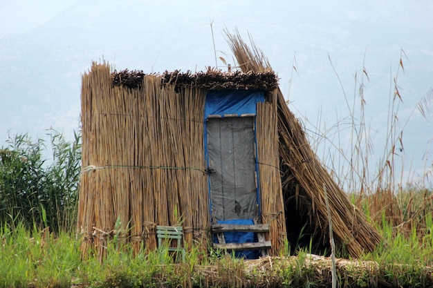 Lake shore and grass hut