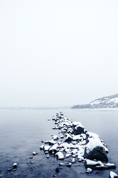 a lake on a snowy day