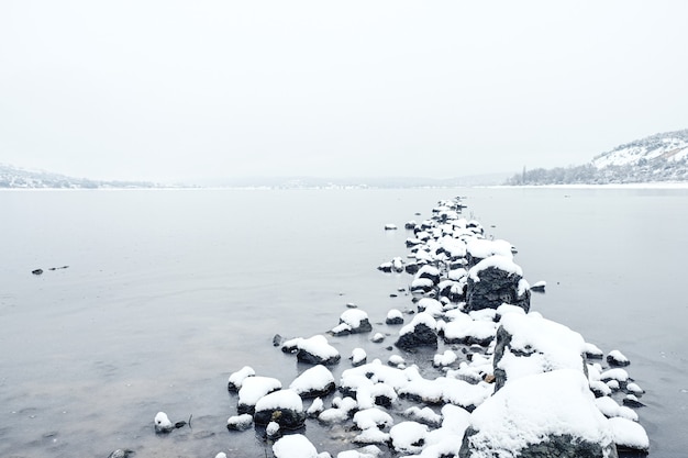 a lake on a snowy day
