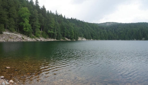 a lake with a mountain in the background and a mountain in the background