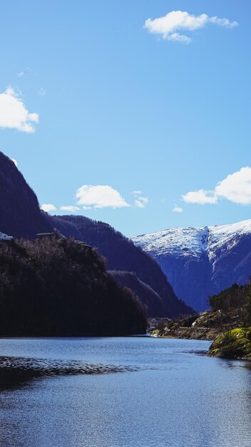 A lake with mountains in the background