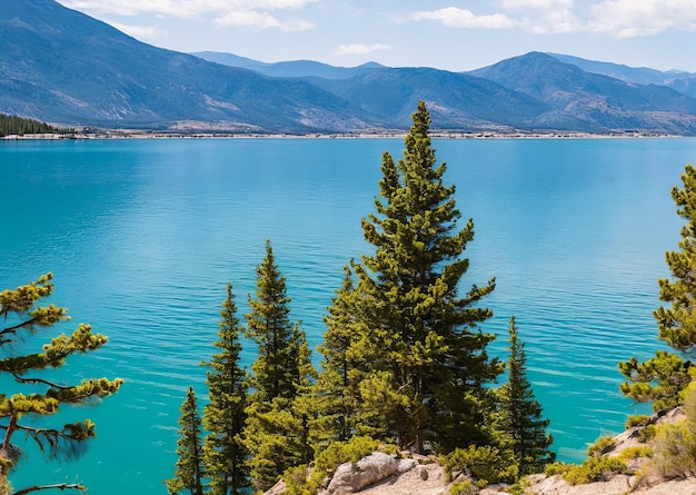 A lake with mountains in the background