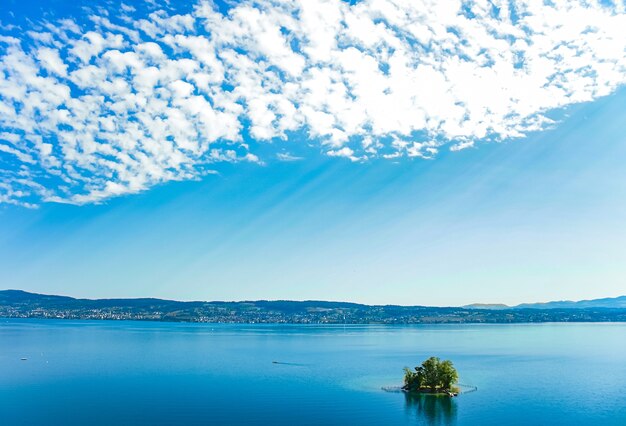 Lake zurich in wollerau canton of schwyz in switzerland zurichsee swiss mountains landscape blue water and sky idyllic nature