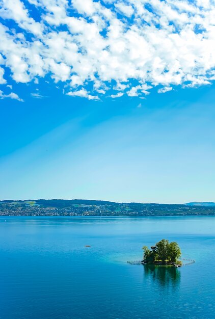 Lake zurich in wollerau canton of schwyz in switzerland zurichsee swiss mountains landscape blue water and sky in summer idyllic nature and perfect travel destination ideal as scenic art print