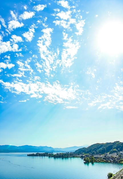 Lake zurich in wollerau canton of schwyz in switzerland zurichsee swiss mountains landscape blue water and sky in summer idyllic nature and perfect travel destination ideal as scenic art print