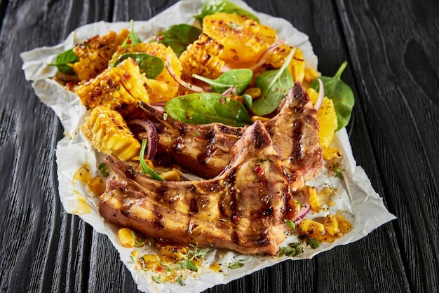 Lamb chops and corn on parchment