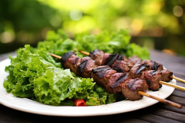 Lamb kebabs on bed of leafy greens