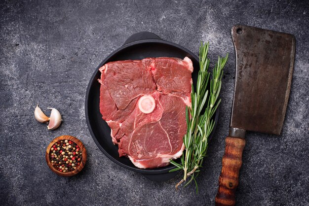 Lamb meat with rosemary, spices and cleaver. 