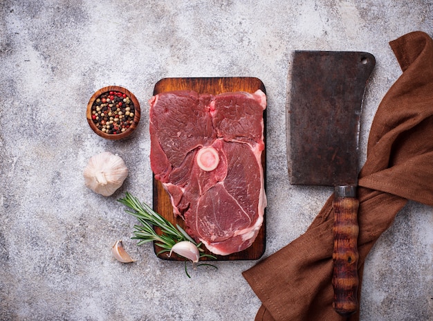 Lamb meat with rosemary, spices and cleaver. 