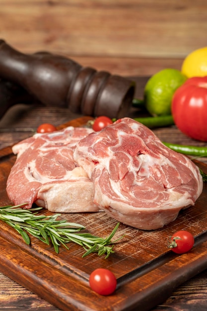 Lamb neck meat Uncooked raw lamb neck on a wooden serving board