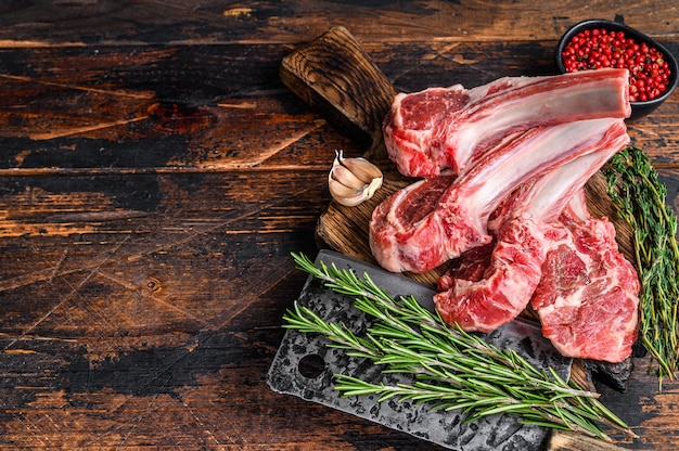 Lamb raw chops  steaks on butcher cutting board