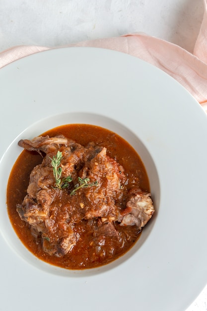 Lamb stew with aromatic herbs seen from above