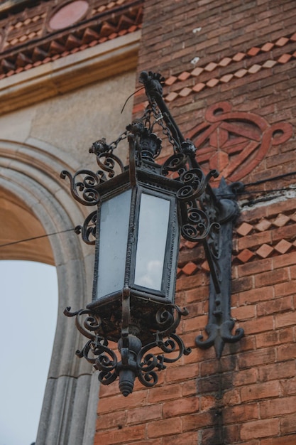 A lamp on a brick wall with the word st. petersburg on it