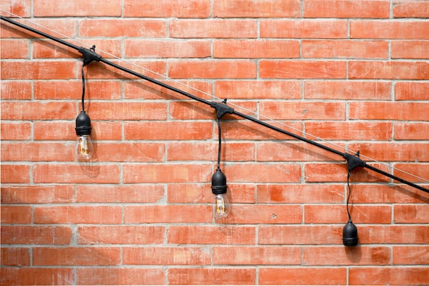 Lamp on brick wall