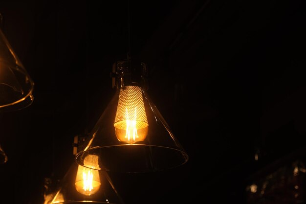 A lamp in the dark with the light on