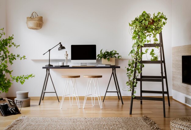 Photo lamp and desktop computer on black desk in workspace interior wi