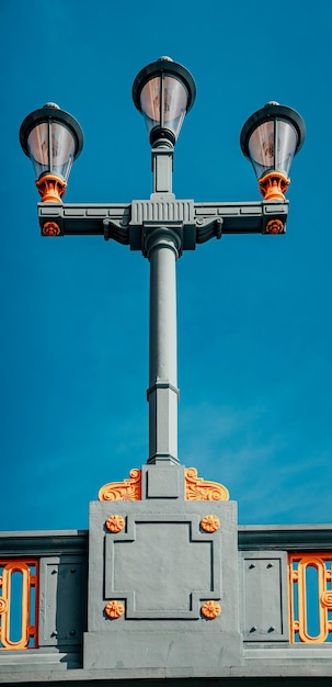 Lamp post on a bridge against negative space