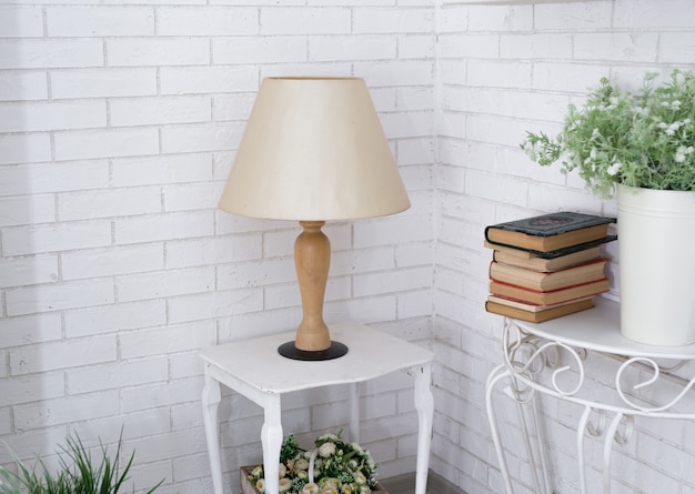 Lamp on a table in a white room