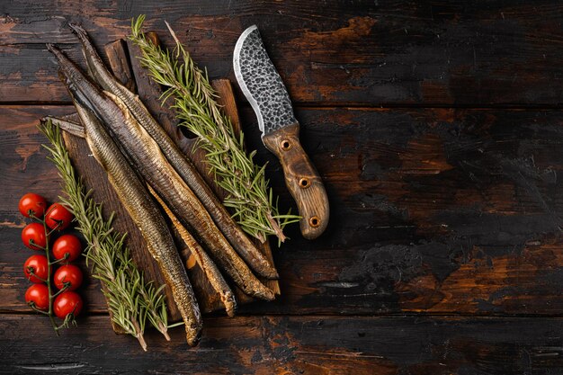 Lamprey with herbs set, on old dark  wooden table background, top view flat lay, with copy space for text