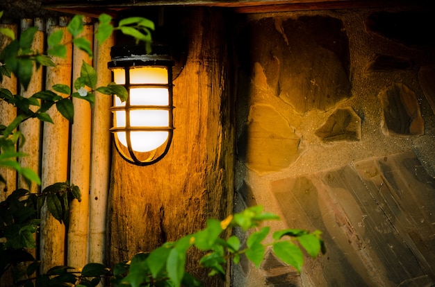 Lamps in front of the cottage at night.