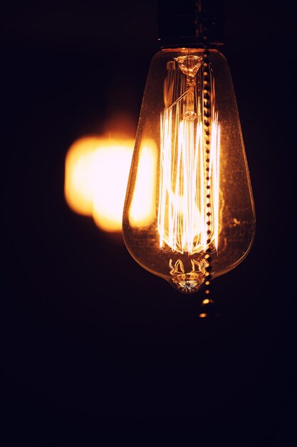 Lamps with tungsten filament. Edison light bulb. Filament filament in vintage lamps. Retro design of light bulbs.