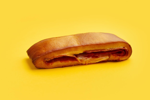 Lanche misto traditional portuguese sandwich with cheese and chorizo Tasty breakfast over yellow background Restaurant cafe menu