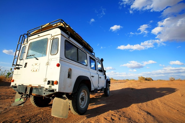 Photo land vehicle with sky in background