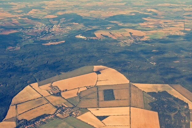 The land with meadows forests settlement view from above