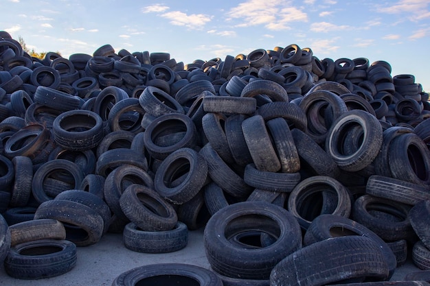 Landfill with old tires and tires for recycling reuse of waste\
rubber tires disposal of used tires used wheels for recycling