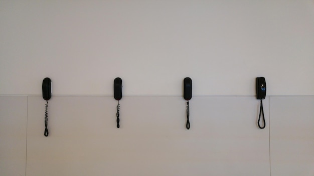 Photo landline phones mounted on wall