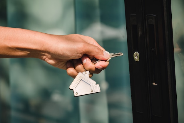 Landlord unlocks the house key for new house