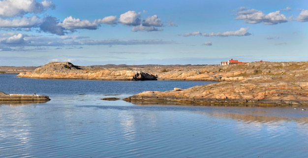 Landscape of the baltic sea in island of Smogen coastlie with typical house in back