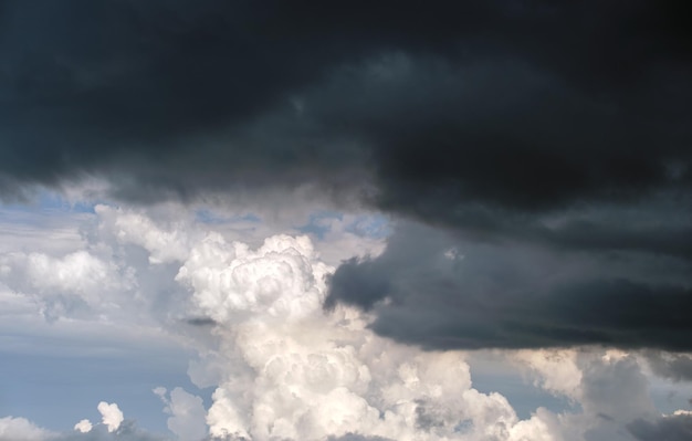 Landscape of dark ominous clouds forming on stormy sky during\
heavy thunderstorm