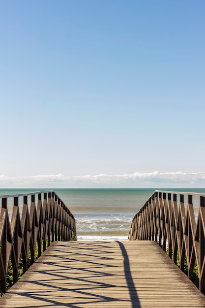 Landscape. Deck Bridge over the sand at the beach